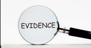 magnifying lens with the word "Evidence" written.